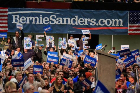 Sanders supporters hold up signs spelling out the Vermont senator's name at his rally at Roy Wilkins Auditorium on March 2, 2020.