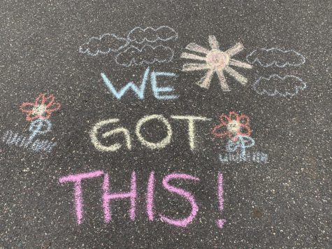Encouraging messages are written on driveways for people driving past.