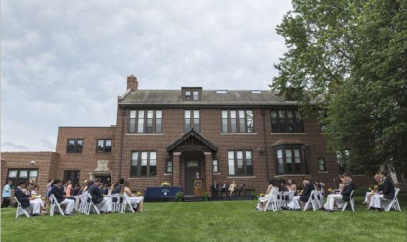 The graduating class of 2015 sits on the lawn for a traditional SPA graduation. 
