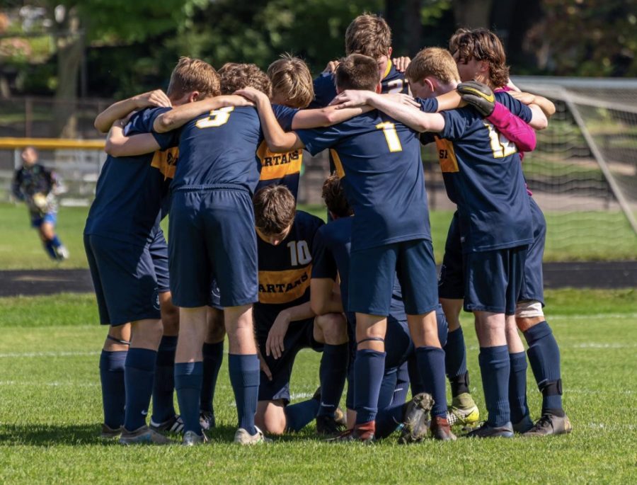 SPA boys varsity soccer in a team huddle on September 14, 2019, vs Providence Academy.
