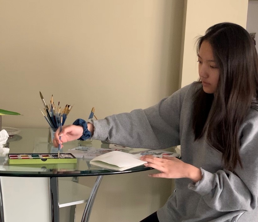 Senior Ashley Su works on her art seminar project from home. 