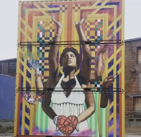 Artists paint tribute murals of Floyd, messages for change