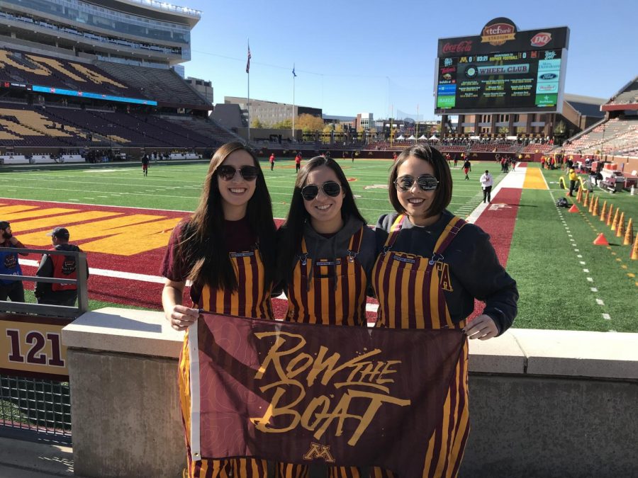 Here, LeMinh (far right) is at a Gophers game with her two sisters.