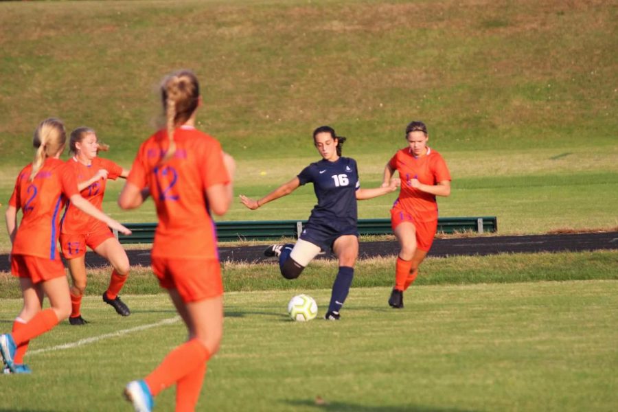 Senior Olivia Lagos controls the ball against Washburn High School.