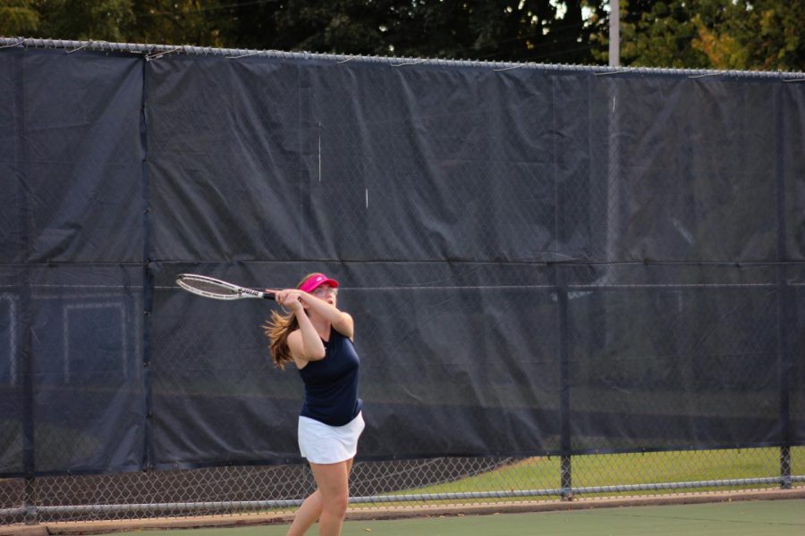 Sophomore Ali Browne returns a ball during her singles match.