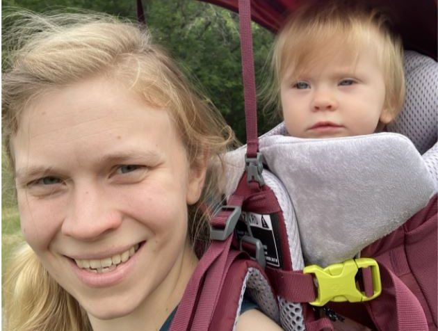 Photo submitted by Anne Boemler, US English teacher of her with her baby in a hiking carrier.