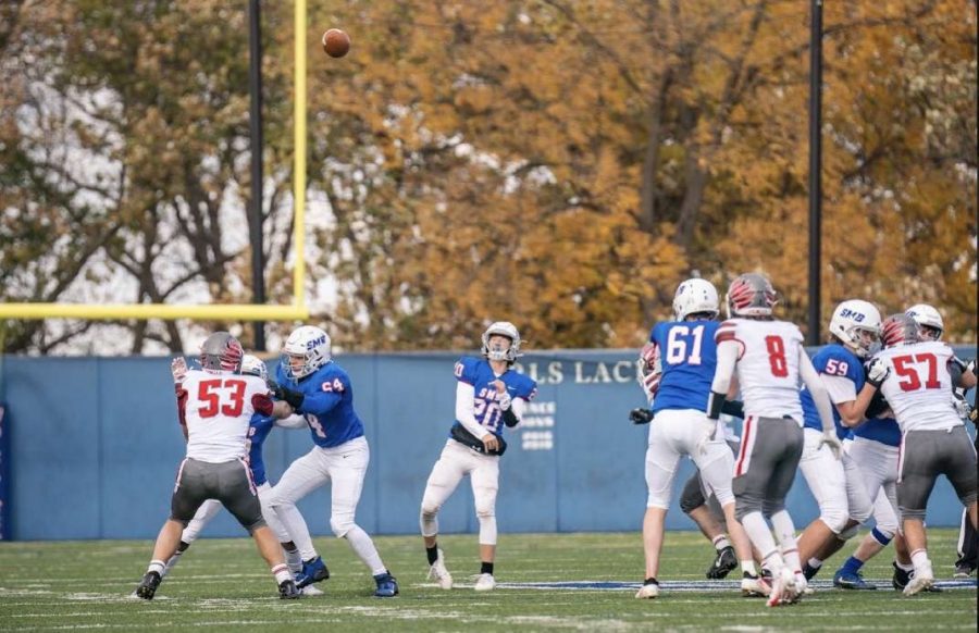 Junior Judah Thomas launches the ball into the air for a reception.