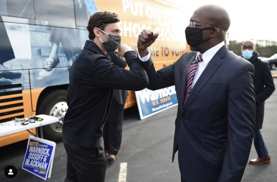 Winners of the Georgia Senate runoffs Jon Ossoff (left), and Raphael Warnock (right), celebrate their victories together.