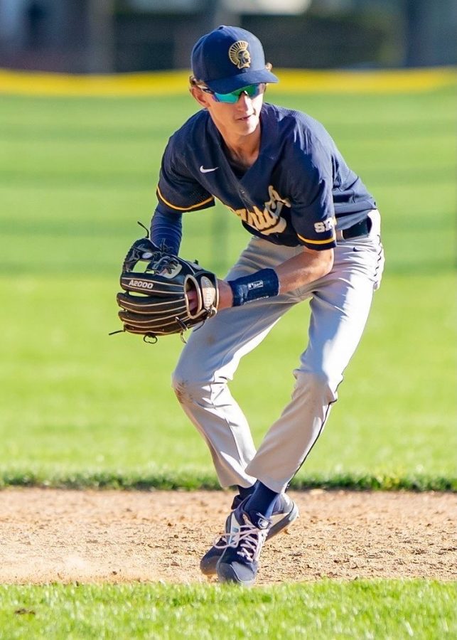 Junior Boden Strafelda throwing the baseball.