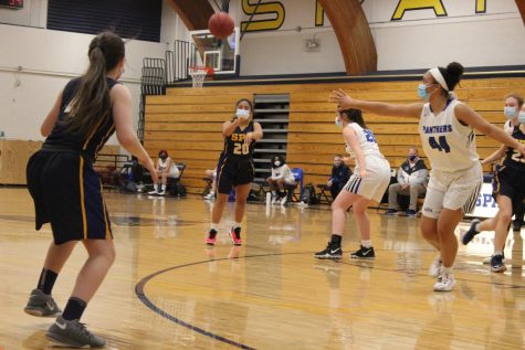 9th grader Naomi Kempcke gives a nice pass to senior captain Jane Christakos.