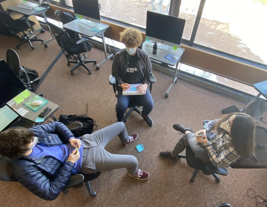 Ibid yearbook editors Levi Smetana, Eddie Gamble, and Leona Barocas work on a team storytelling activity to prepare for feature assignments in the winter section of the 2021 yearbook.
