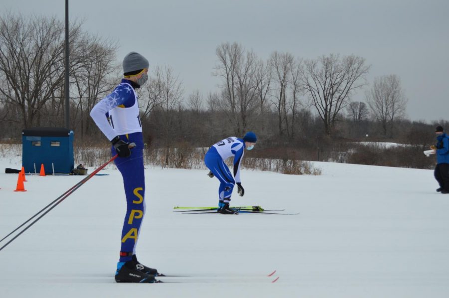 Senior John Hall gets warmed up before a team practice.