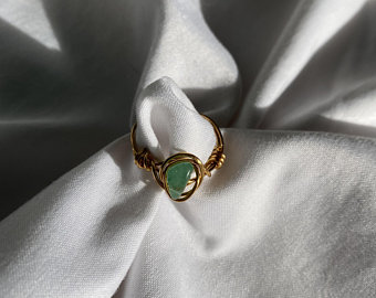 This Green Aventurine Gemstone Wire-wrapped ring”  can be purchased and found on Kathleen Wosepka’s Etsy account @PlanetaryJewelry.