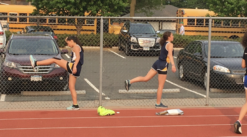 Senior Mia Schubert (left) has been the captain for the track team for 2 years now. 