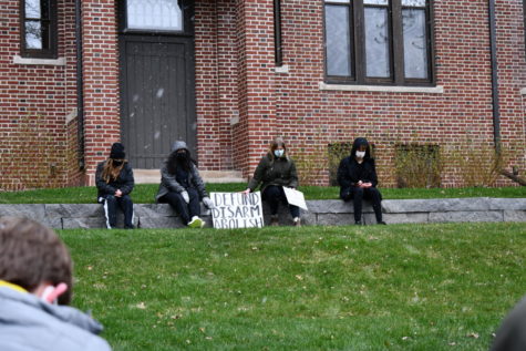 (From left) Senior Evelyn Lillemoe, senior Aman Rahman, junior Ellie Murphy, and senior Gavin Kimmel sit in a minute of silence in honor of police brutality victim Daunte Wright.