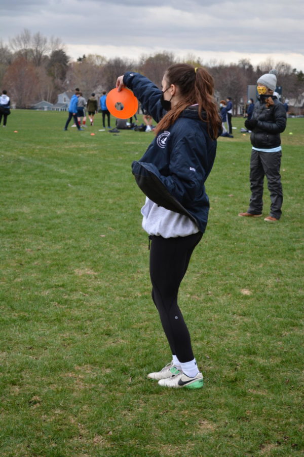 Senior Julia Baron prepares to toss the frisbee during a practice.