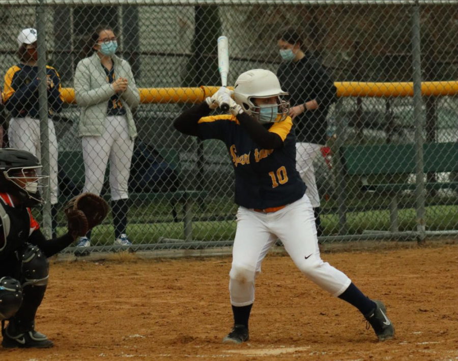 During their game, Sophomore Greta Magnuson prepares to take a pitch.