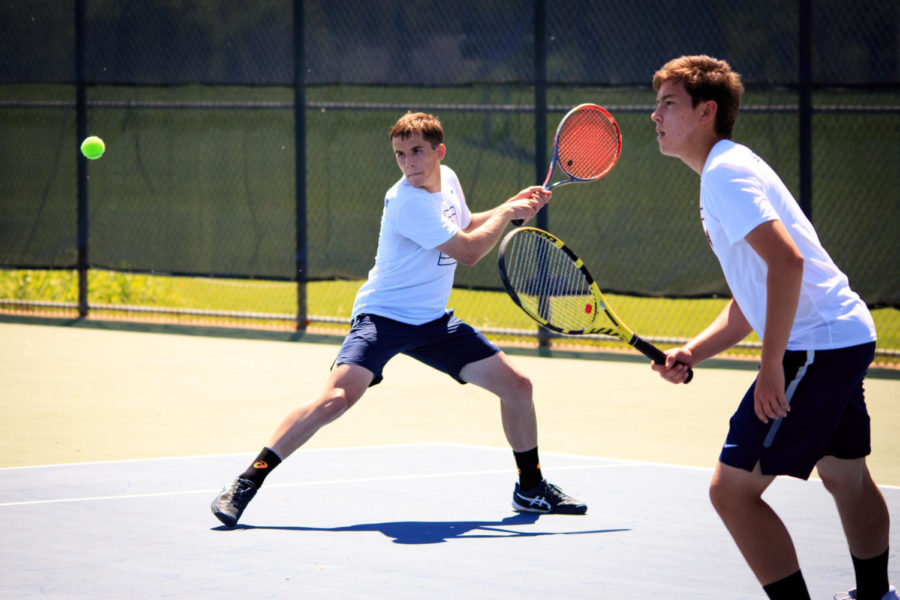  Moore shifts into a lunge to get ready for a backhand volley.