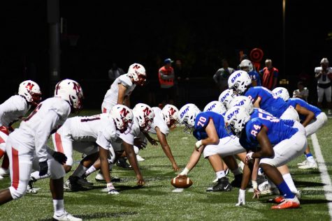 LINE OF SCRIMMAGE. SMB Wolfpack starts a play in a heated match with North St. Paul Sept. 10 that ended in a 48-20 win for the pack. “I feel like this year we’ve had a lot more time to connect and become a team,” quarterback Connor Overgaard said.