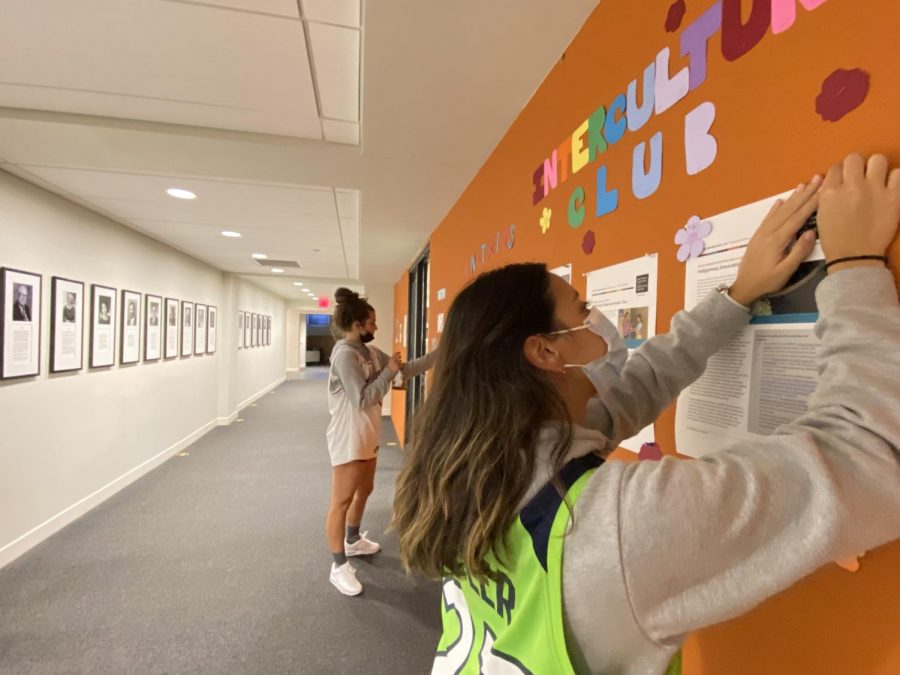 Seniors Nina Starchook and Kat Bragg get ready to design their respective club boards.