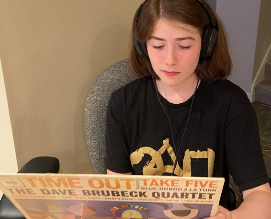 LISTEN UP. Sophomore Eliza Farley enjoys her downtime listening to her current favorite songs. "I like listening to music because it’s both calming and fun," she said.