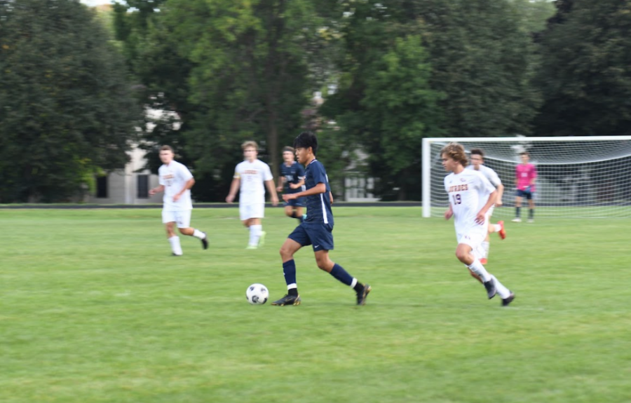 Sophomore Orion Kim receives the ball and dribbles up the field.  