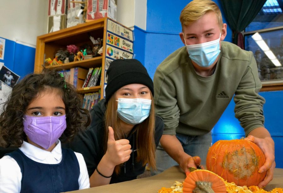 Seniors Zekiah Juulison and Sarian Charpentier make the first cuts into their pumpkin. Julison remarked, “We all had so much fun getting into the Halloween spirit.” 