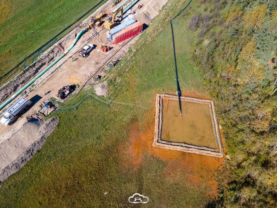 Enbridge holds wastewater in a makeshift pool which allows the contaminated water to run off into the local prairie and woods, while they pump it to another location.