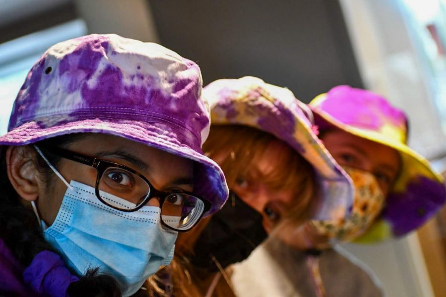 Seniors Divya Bhargava, Eleanor Smith and Marie Schumacher purple out during the school day for their meet.