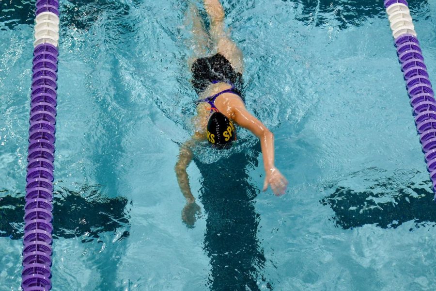 Senior Marie Schumacher keeps her head down as she heads for the last turn of her race.