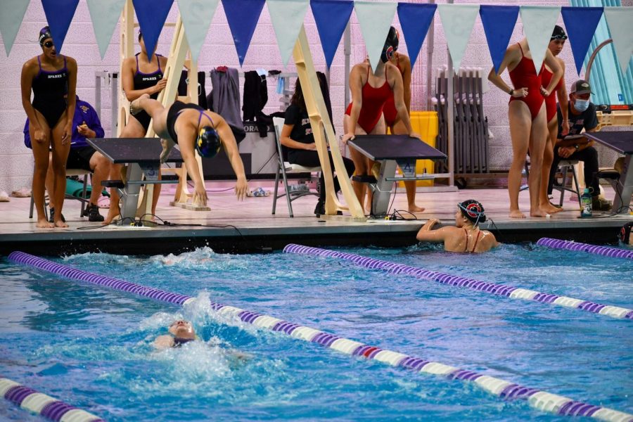 During the relay, swimmers must time themselves perfectly. Just as the previous swimmer touches the wall, the next swimmer jumps in.