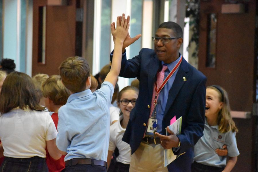 GIVE ME FIVE. Ottley engages with students at St. Martins with positivity and enthusiasm. He plans to keep the same engagement with the SPA community and build strong connections with the students, faculty and parents. 