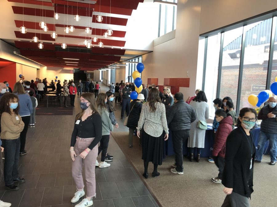 WELCOME TO MY HOUSE. Student tour guides, faculty, and guest families gather in The Huss Center Nov. 14 for the fall open house.