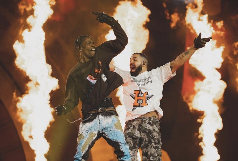 Travis Scott and Drake perform together during the Astroworld Festival. Meanwhile, screams and cries from below remain muffled by the loud music.