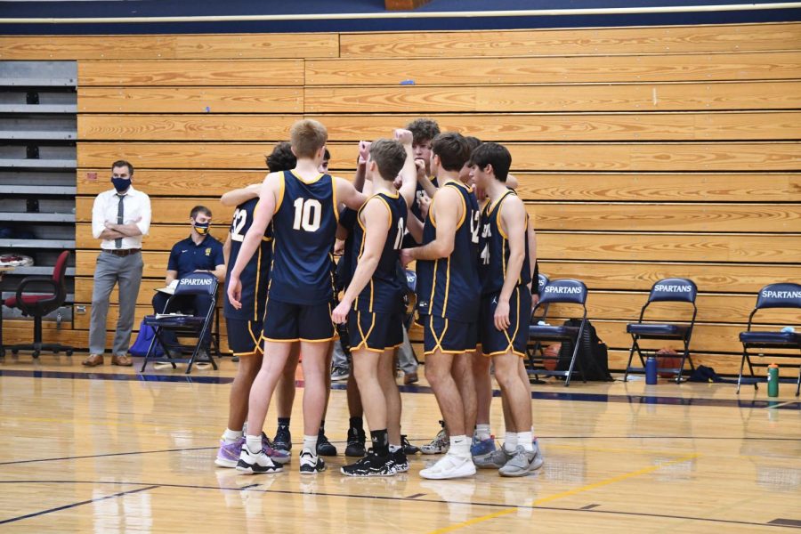 The team circles up before the conclusion of halftime, going over their game plan for one last time before the half resumes.