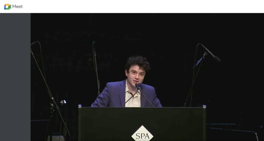 Nathan+Mann+delivers+his+speech+in+front+of+a+crowd+comprised+of+the+senior+class%2C+a+handful+of+mixed+advisories%2C+and+selected+visitors.+Students+in+grades+9-11+watched+a+livestream+in+their+advisories+to+reduce+the+number+of+people+gathered+in+the+Huss.