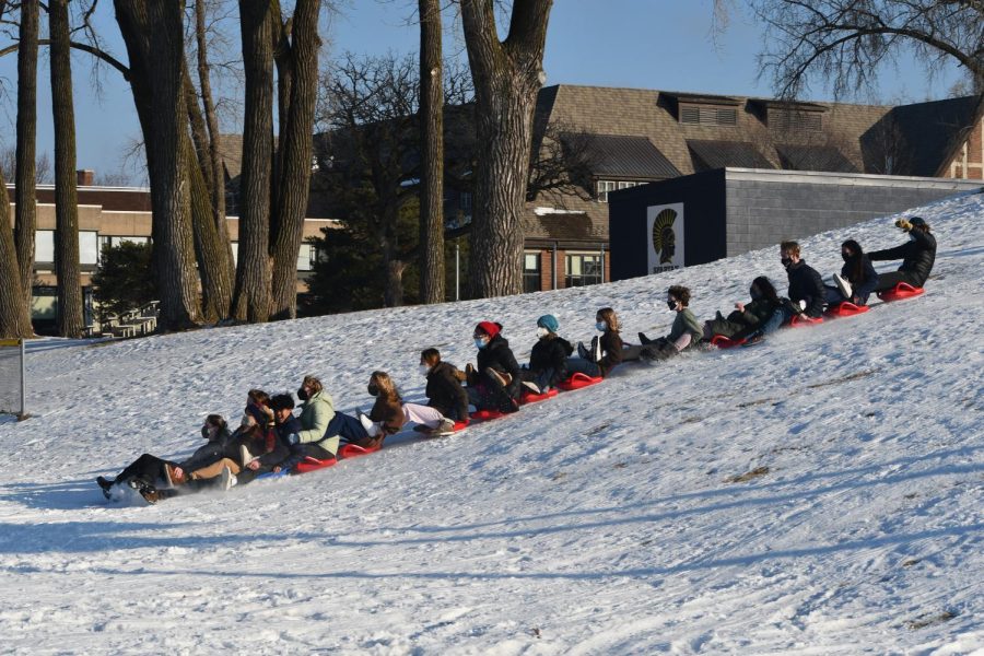 LINKED TOGETHER. Under the warm sunlight, fifteen Upper School students go down the hill together as one.