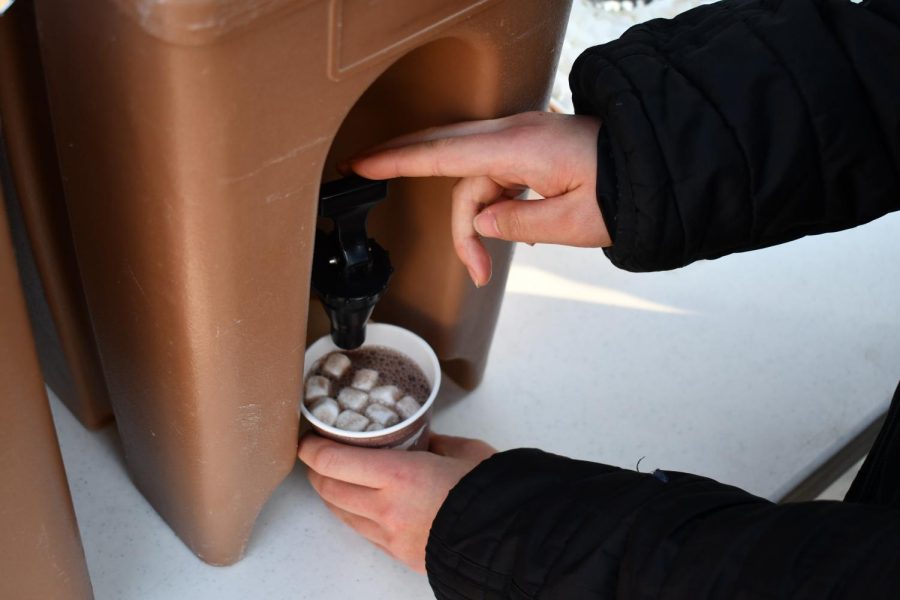 MARSHMELLOW FUN. After embracing the cold, students enjoyed cups of hot chocolate outside in the Lilly Courtyard.