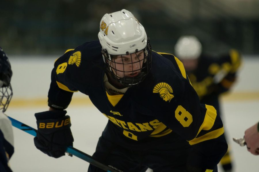Senior Teo Dieperink waits for the referee to drop the puck in an important offensive possesion.