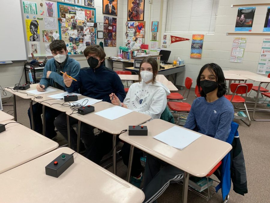 ROCK AND ROLL. Last night, (left to right) junior Colin Will, junior Asa Zirps, sophomore Bridget Keel and 9th grader Rohan Kharbanda continued SPA quiz bowl teams winning streak to 12-0.