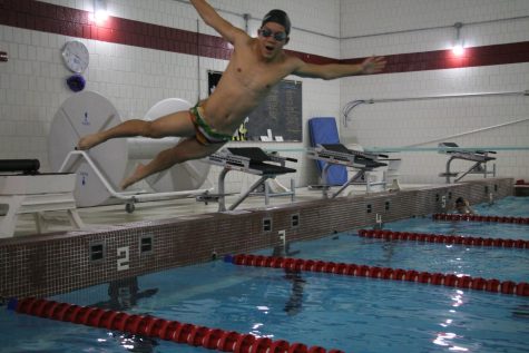 Senior Pah Na leaps into the pool.