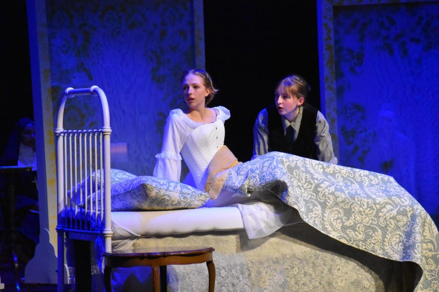 VOICES IN HER HEAD. Junior Mimi Huelster, right, represents senior Annika Brelsford's inner conflict. 
