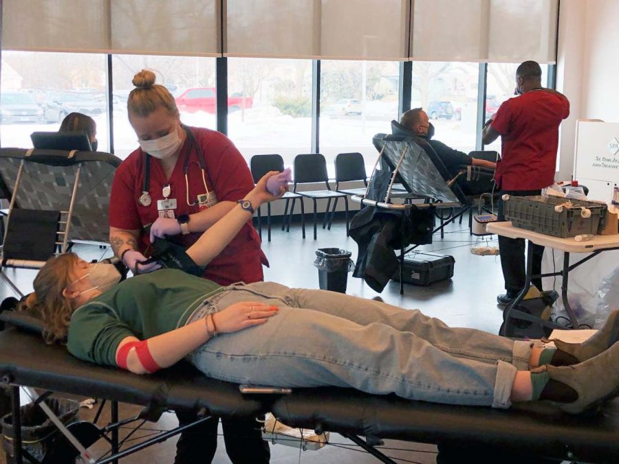 Senior Ellie Murphy gets her blood drawn by a nurse from American Red Cross. 