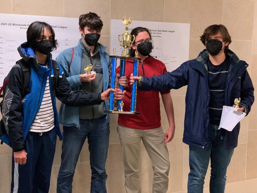 Rohan Kharbanda, Colin Will, Dom Polley, and Asa Zirps hold their third place trophy after state Quiz Bowl Feb. 17.