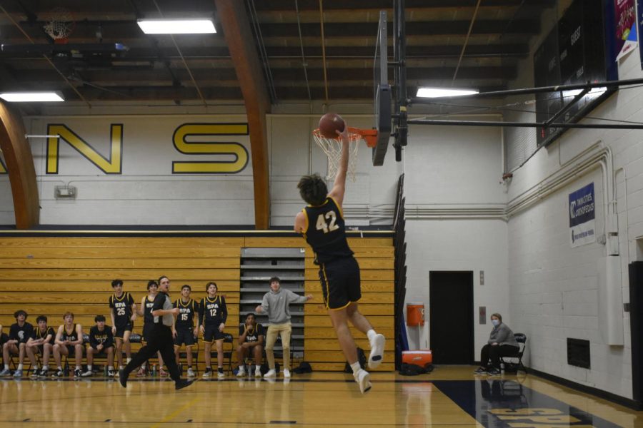 Captain Gregory Forsberg scores the fast break layup.