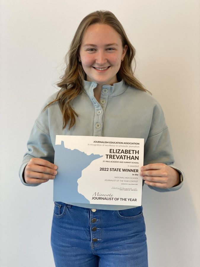 DOUBLE JOY. Co-Director Elizabeth Trevathan smiles as she receives her Journalist of the Year award. Trevathan said, "I think 9th grade me is freaking out right now. It feels very strange… very surreal."