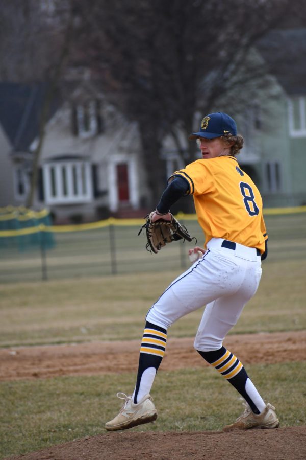 WIND UP: Captain Boden Strefelda winds up as he gets ready to pitch against a batter from St. Croix Prep Academy