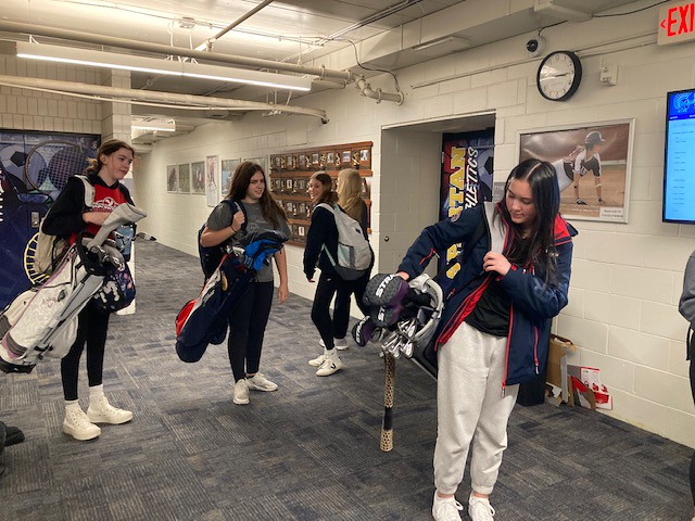 Spartan Golf picks up their clubs in the Athletics hallway on the way to practice Apr. 7. The team is smaller than past years but Head Coach Angie Kritta said that having fewer players can actually be a benefit when it comes to competition: “The nice thing is I can give the girls more of an opportunity to play in a varsity event.