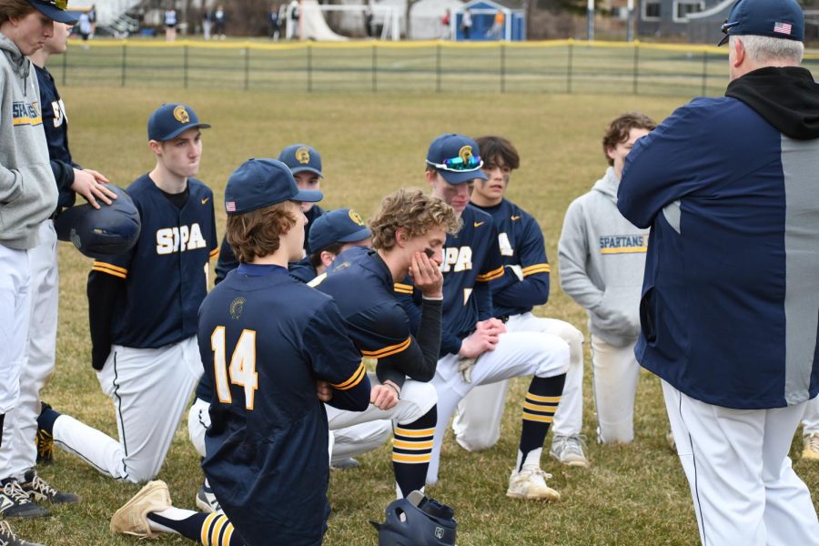 POST GAME TALK: After a tough game against Highland Park, coach Rob Thompson gives his team a pep talk