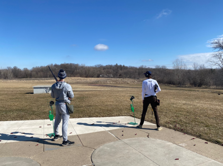 PULL. Captain Max Shaffer calls as he cues the clay disk to shoot out of the trap house.